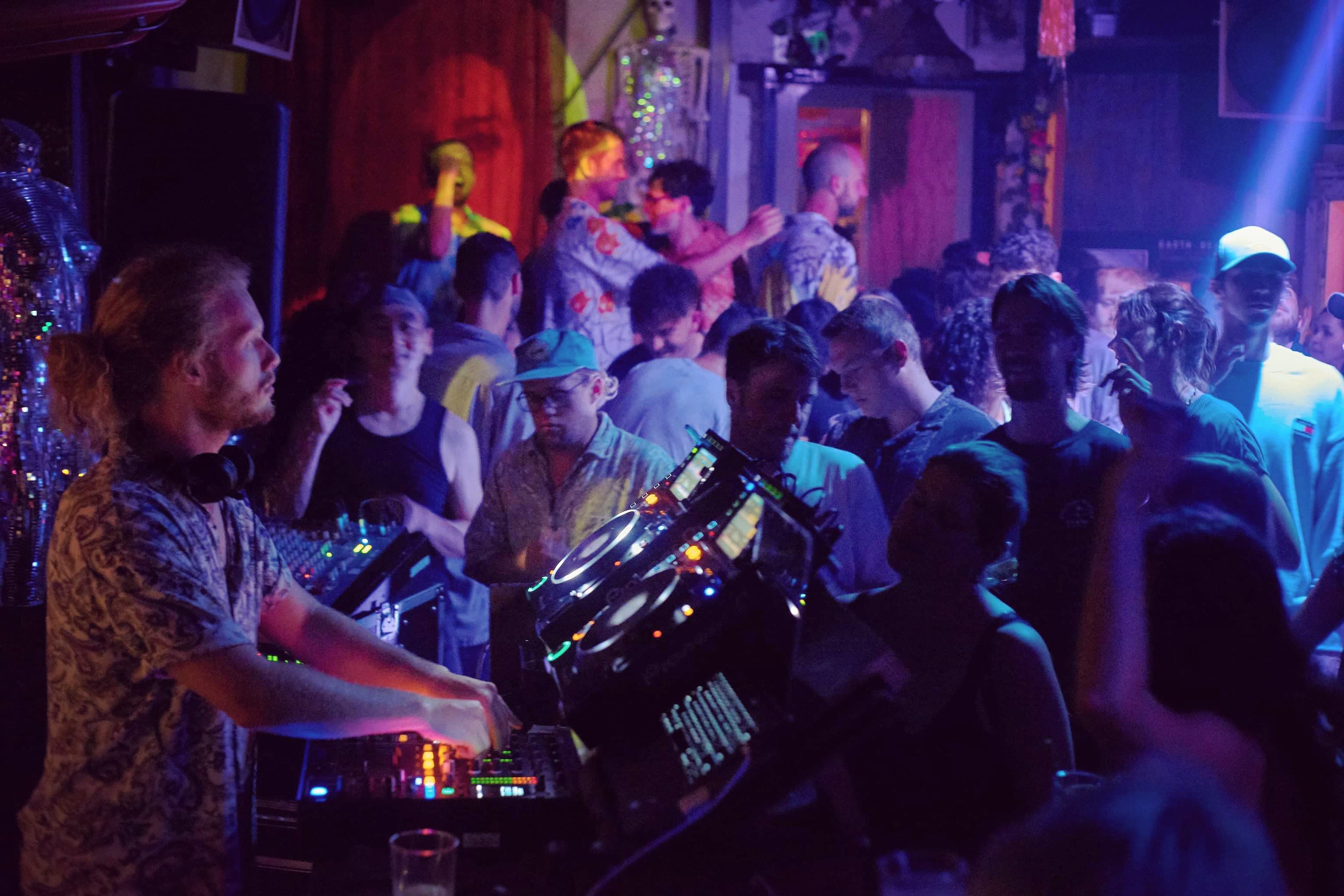 Nomadic DJing at Laundry Bar in purple light