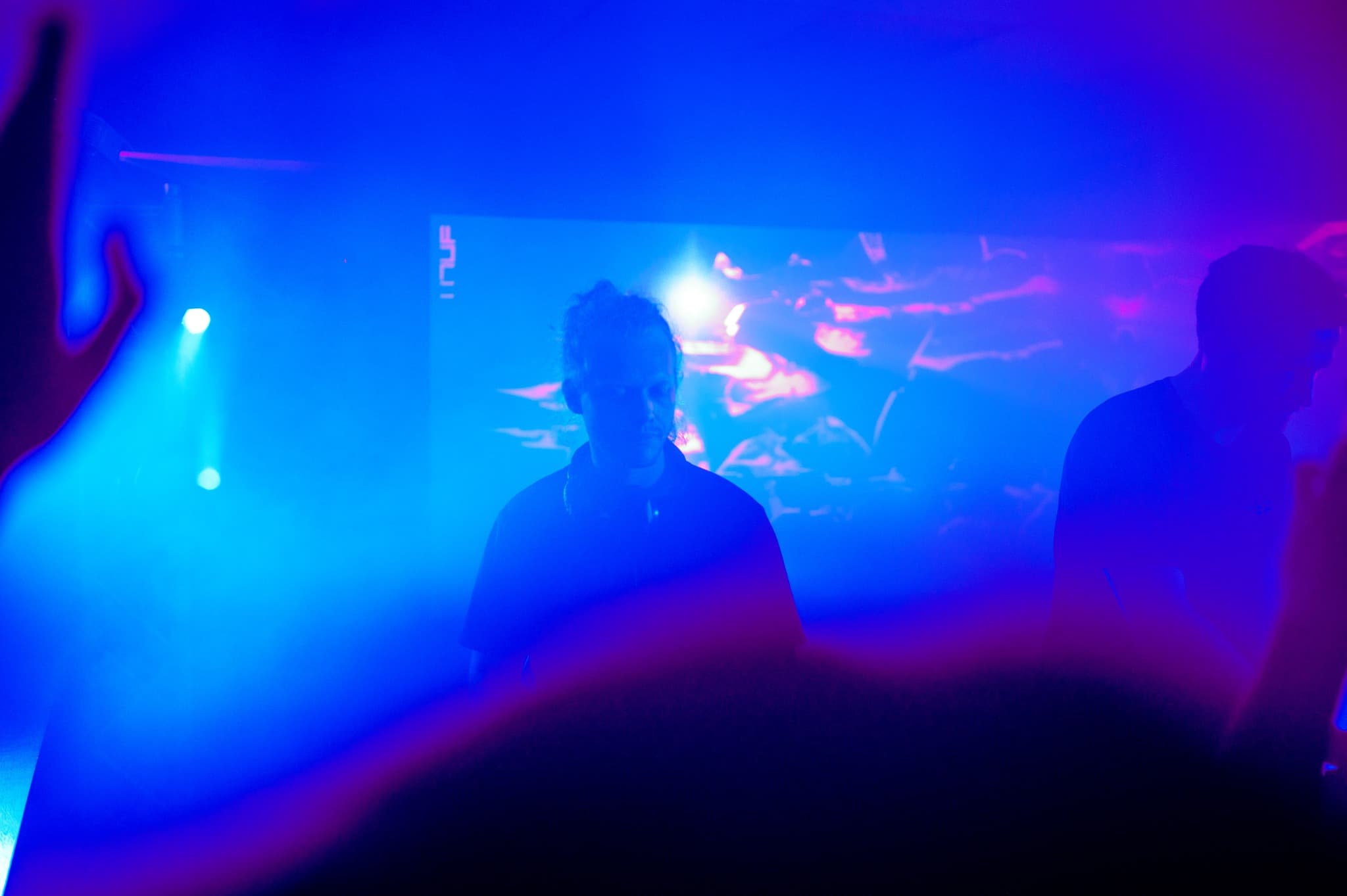 Nomadic DJing at a Wellington club under blue light